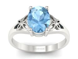 Złoty pierścionek z topazem białe złoto - jg347btp