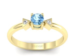 Złoty pierścionek z topazem i brylantami