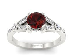 Pierścionek z granatem i brylantami białe złoto - P15304bgr