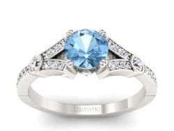 Pierścionek z topazem i brylantami białe złoto - P15304btp