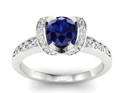 Pierścionek z szafirem i brylantami białe złoto - p16034bsz
