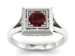 Pierścionek z granatem w oprawie z białego złota 585 - p16147bgr