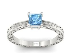 Subtelny złoty pierścionek z topazem w białym złocie - p16275ba