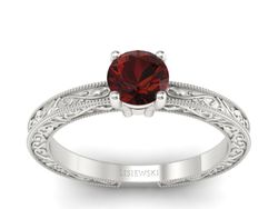 Pierścionek z granatem w białym złocie pełen blasku - p16277bgr