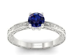 Złoty pierścionek z szafirem w białym złocie próby 585 - p16278bsz