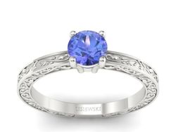Złoty pierścionek z tanzanitem w białym złocie 585 - p16278bt