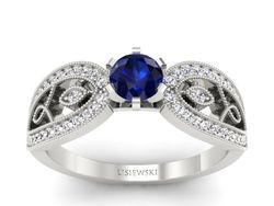 Pierścionek z szafirem i brylantami białe złoto - p16315bsz